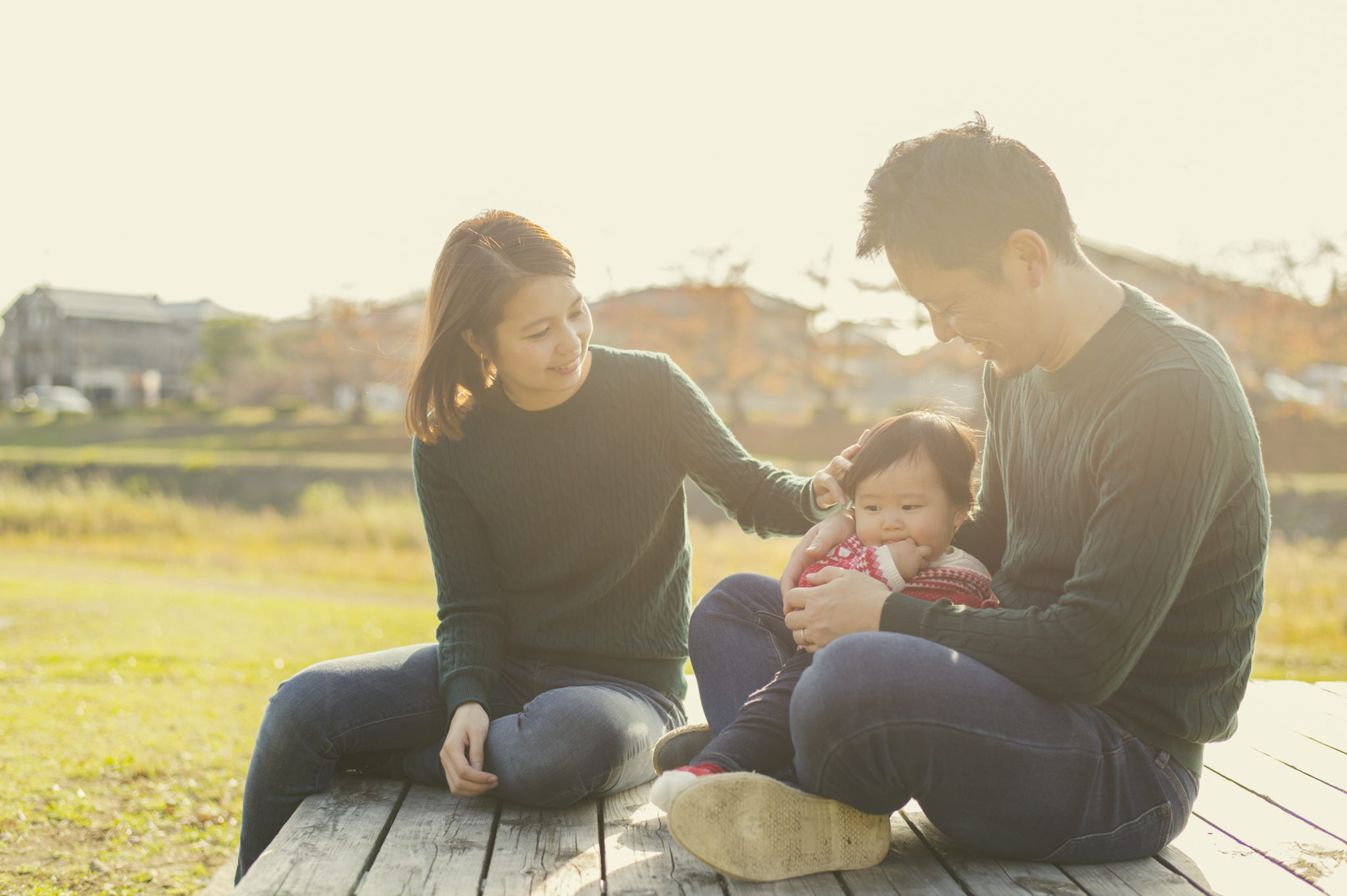 Happy family having a good time with baby girl