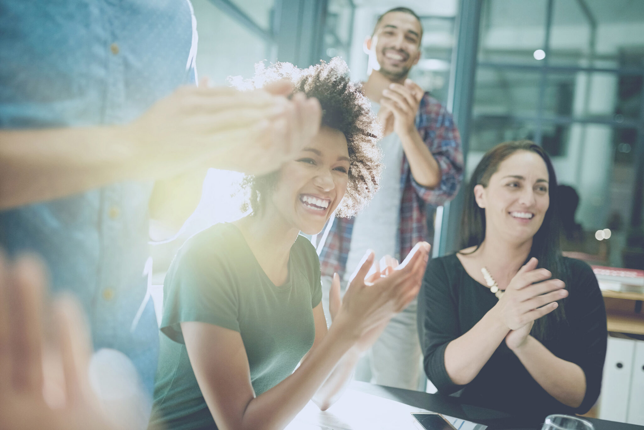 colleagues are clapping in office